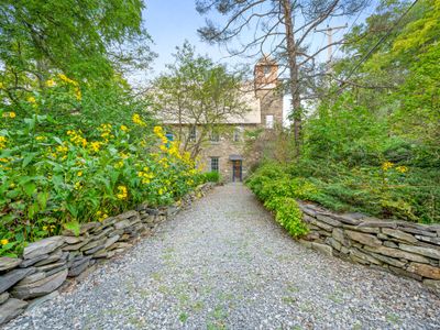 Local flora lines The Rifton's stunning garden pathway.