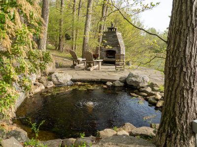 On the lower level of the gardens, you'll find a koi pond and outdoor fireplace, perfect for cozying up on cool nights.