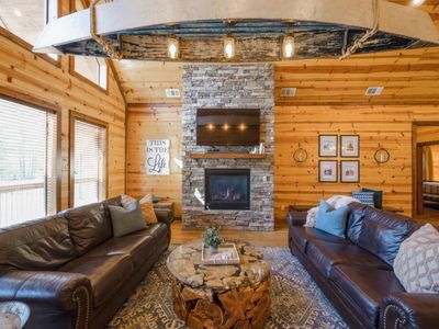 The main living room is the heart of the cabin with 2 sofas and a gas fireplace!