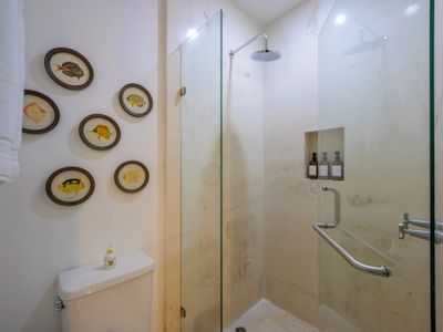 Vanity, Marble Shower, Spa-Grade Toiletries, and Luxury Linens