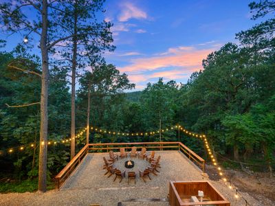 Down the stairs you will find a fire pit with Adirondack chairs!