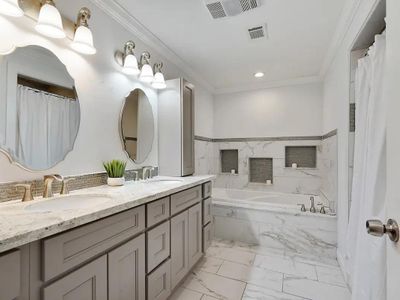 Master bathroom attached to master bedroom | Downstairs | Tub + Shower