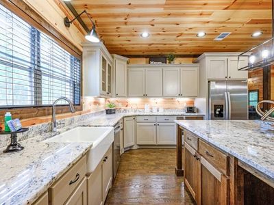 The kitchen is spacious with all the counter space.