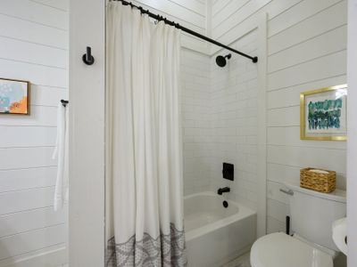 The private bathroom has a tub/shower combo.