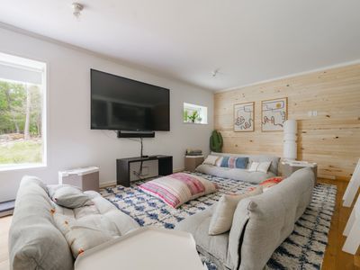 The bunkroom includes a cozy living space with smart tv!