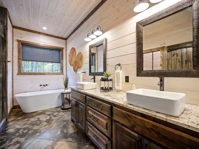 The attached private bathroom with walk-in shower and soaking tub.