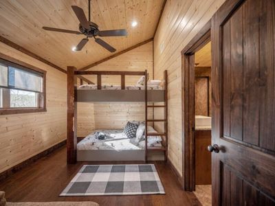 Upstairs- (1)-Queen over Queen bunk beds w/futon for additional sleeping