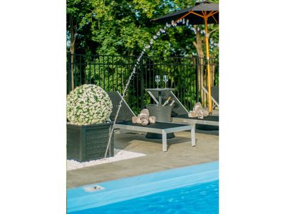 These unique poolside coolers double as a table top, perfect for resting your glass and chilling your champagne.