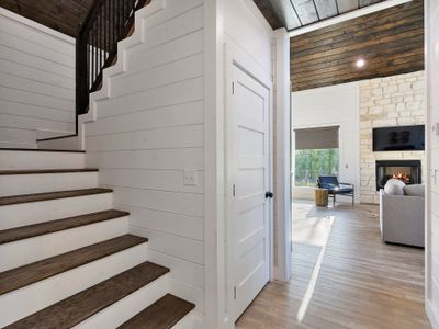 The staircase next to the laundry closet!