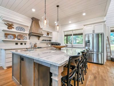 The kitchen provides extra seating at the island.