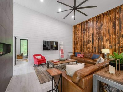 There is plenty of seating in this main living room. Game room thru the door.