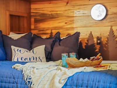 Immerse yourself in this dreamy bunk retreat where every bed feels like its own little cabin in the trees.