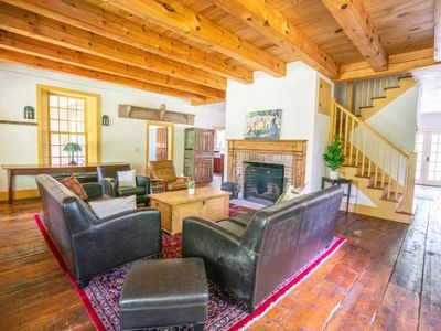 Main floor living area with fireplace and small library