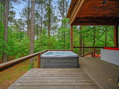 The hot tub sits behind the couch so that you don't miss a moment.