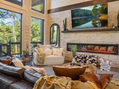 Warm wood, rich fabrics, and panoramic forest views—this is comfort elevated.
