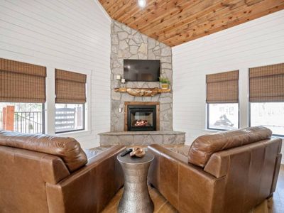 Luxury seating around a floor to ceiling fire place!