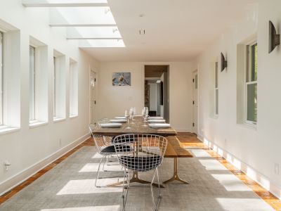 Gazing from the dining room back towards the kitchen, living room and foyer.