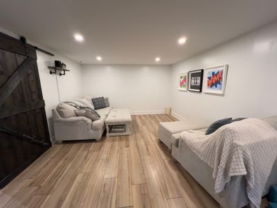 The projector in this media room makes for a perfect, chill hang.