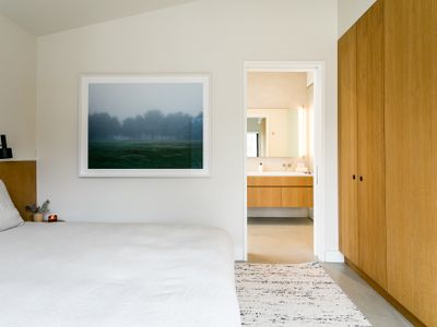 The primary bedroom features an ensuite bath and direct access onto the patio.