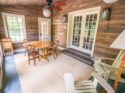 Sunroom connected to kitchen, dining room and back patio.
