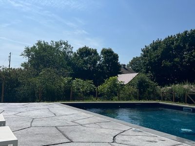 This gorgeous pool and patio is the perfect place to relax under the open sky