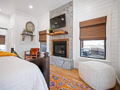 A floor to ceiling fireplace and smart tv in the King Suite!