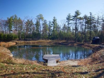 View of the pond from the guest house patio, playhouse in the distance