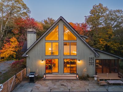 Beautiful picture windows overlook the back patio