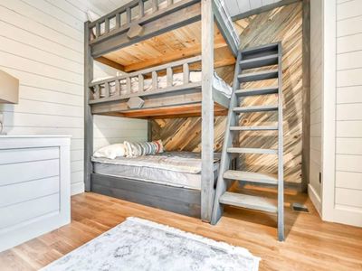On the ground level is a 3-tier Bunk room with 3 double beds.