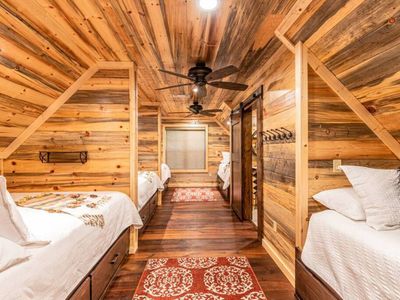The bunk room with 3 Queens and 2 Twin XL beds