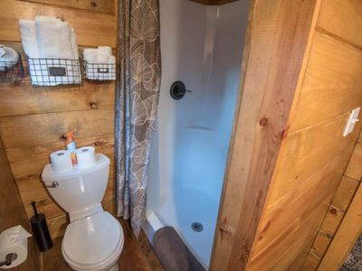 Room 3/4 upstairs holds a Queen as well as an exit to outside. Private full bath