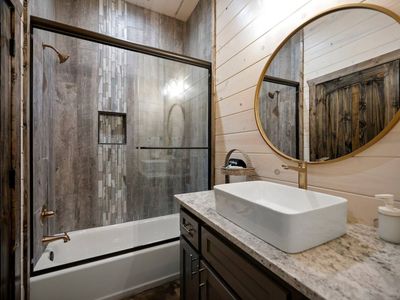 Bathroom with tub/shower.