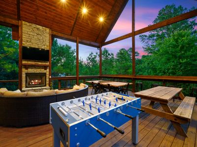 Foosball and multiple tables await on the covered deck!