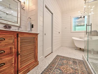 The private bath with a walk-in shower and soaking tub.