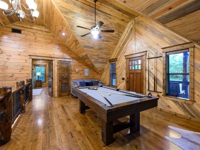 The loft has a pool table, Queen sofa sleeper and access to the balcony/