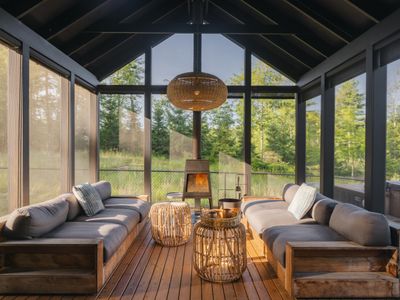 Pool House lounge area with wood burning stove.