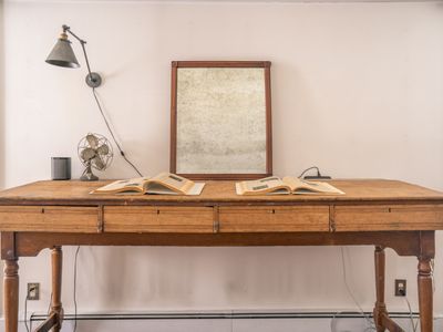 This antique desk is calling for you to embrace your inner scholar.