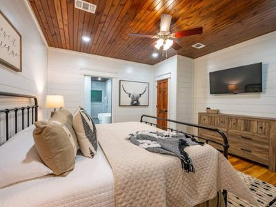 A smart tv and dresser are found in the suite for guest convenience!