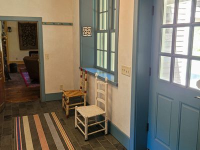 Charming blue trim leads you into the entryway