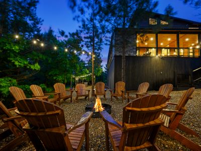 Fire pit with Adirondack chairs.