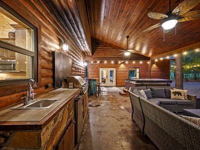 Outside kitchenette with gas grill, sink, mini fridge and more!