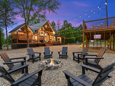 The fire pit out back with Adirondack chairs!