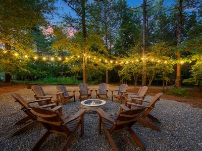 The fire pit is surrounded by chairs perfect for s'mores!