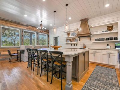 The kitchen and dining area combined have seats for 12.