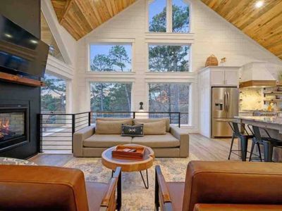 Oversized luxury couch seamlessly transitions into the kitchen.