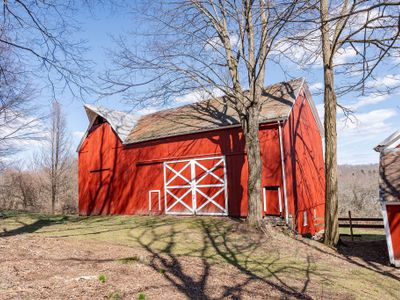 The original barn structures on the property have been immaculately maintained, bringing the history of the land to life.