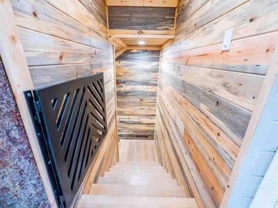 Downstairs to the bottom floor where the game room and 3 bedrooms are housed.
