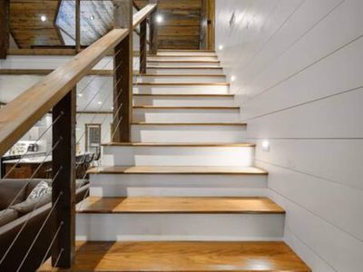 Upstairs takes you to the loft, a King Suite and the bunk room.