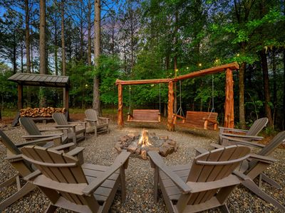 Fire pit with Adirondack chairs and custom swings!