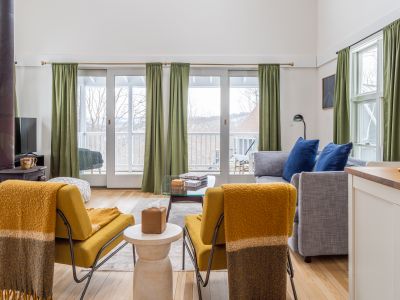Step out onto the screened in porch from the guest house living room.